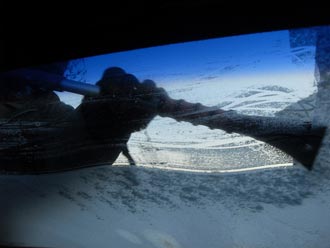 A woman faces careless driving charges after she didn't clear her frosty windshield.