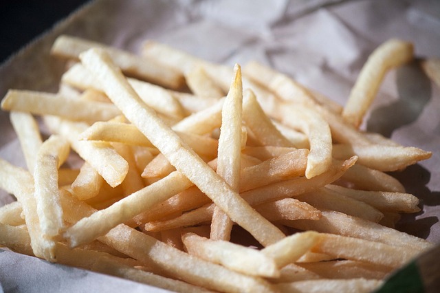 A woman was arrested and charged with Petty Theft for taking 3 french fries from a police officer's plate.